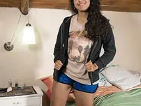 Super-cute Maria F takes off and plays with her long labia hair on the bed