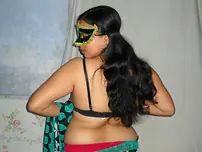 Huge Indian inexperienced Velamma Bhabhi gets totally nude while wearing a mask