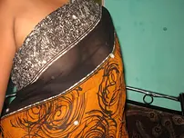 Mature Indian housewife tucks out her tongue while uncovering her all-natural baps