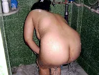 Indian fatty washes her clothes while taking a bathroom at the same time