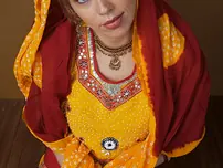 Indian fledgling works free of traditional clothing for a nude shoot