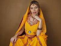 Indian fledgling works free of traditional clothing for a nude shoot