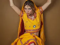 Indian fledgling works free of traditional clothing for a nude shoot