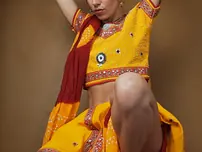 Indian fledgling works free of traditional clothing for a nude shoot