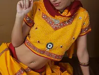 Indian fledgling works free of traditional clothing for a nude shoot