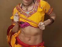 Indian fledgling works free of traditional clothing for a nude shoot