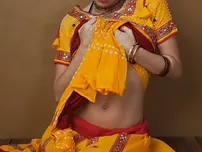 Indian fledgling works free of traditional clothing for a nude shoot