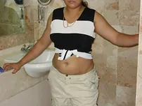 Indian plus-size flashes her big breasts and pubic hair while on the rest room