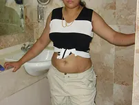 Indian plus-size flashes her big breasts and pubic hair while on the rest room