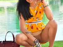 Babe Viva demonstrates her scorching coochie in public while posing in her summer dress