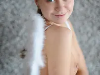 Puny angel Liza demonstrates her off her little hooters and poses erotically in the bare