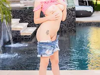 Tiny superstar Coco deepthroating Dredd's monster ebony boner by the pool