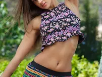 Russian solo chick Melena A finger pounds her shaved snatch on the patio