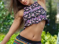 Russian solo chick Melena A finger pounds her shaved snatch on the patio