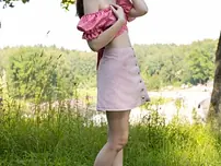 Youthful black-haired gets completely nude on a blanket out on the grass