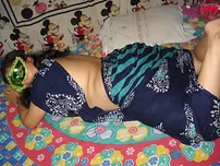 Big Indian doll Delicious decorates up her bare milk cans after getting nude in a mask