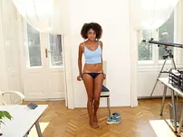 Black nubile Luna Corazon gets nude and exhibits her hefty udders and puss