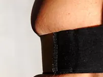 Black-haired COUGAR Lisa Glisten unveils her massive boobies and poses in high stilettos