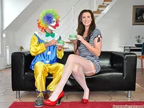 Mature chick has a sexual appointment with a clown in nylons and garters