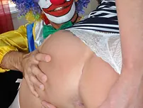 Mature chick has a sexual appointment with a clown in nylons and garters