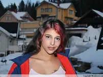Wonderful Indian nubile poses on snow-facialed ground before going naked on a sofa