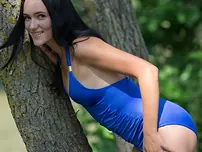 Dark-haired nubile Indiana Blanc liquidates a bikini to stance naked in a brook