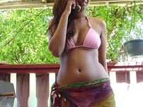 Indian teenager lets out her rigid hooters and a pierced nip from her swimsuit top