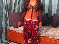 Indian nubile unsheathes her rock hard udders while getting completely bare