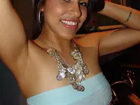 Indian teenager Laurie Vargas undresses bare before getting on top of a wood