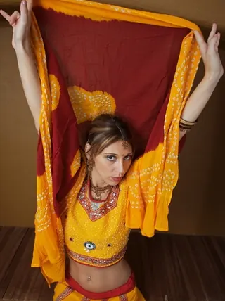 Indian fledgling works free of traditional clothing for a nude shoot