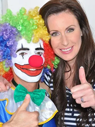 Mature chick has a sexual appointment with a clown in nylons and garters