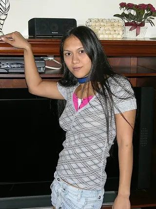 Indian teenager wears a choker while stripping for her first-ever bare poses