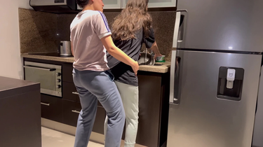 Stepmom can't resist watching as hot Colombian wifey gets her tight pussy eaten while washing dishes in the kitchen